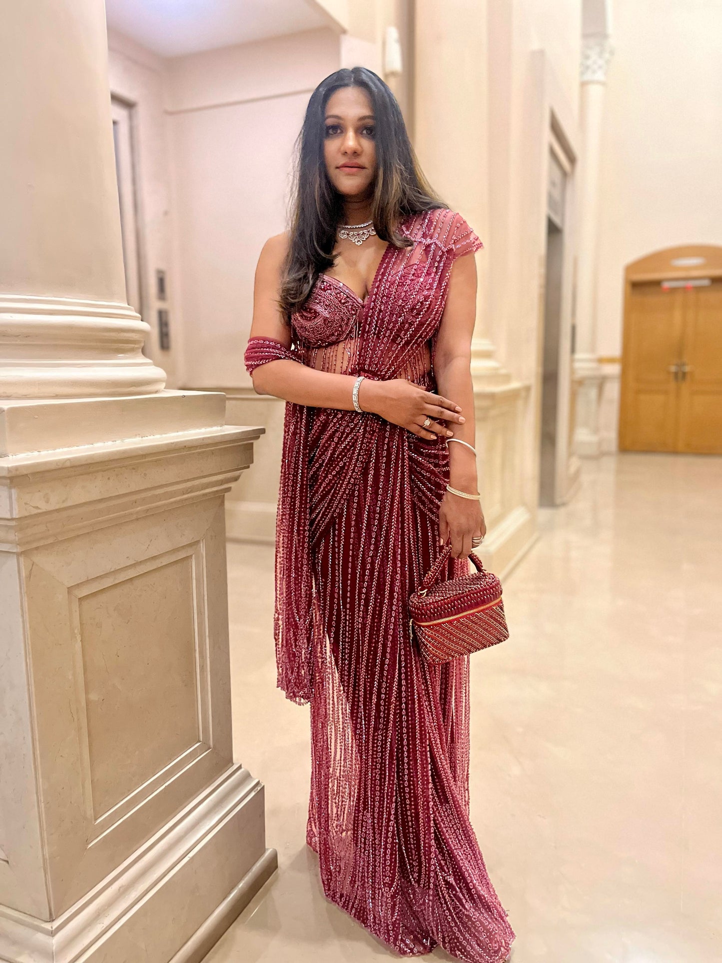 Esha Amiin in our Laura Pearl Red Cube Bag